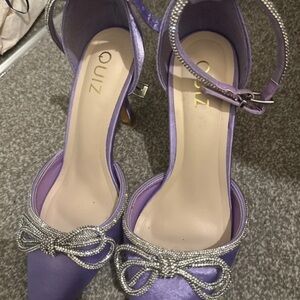 Quiz Purple Heels with Rhinestone Bow